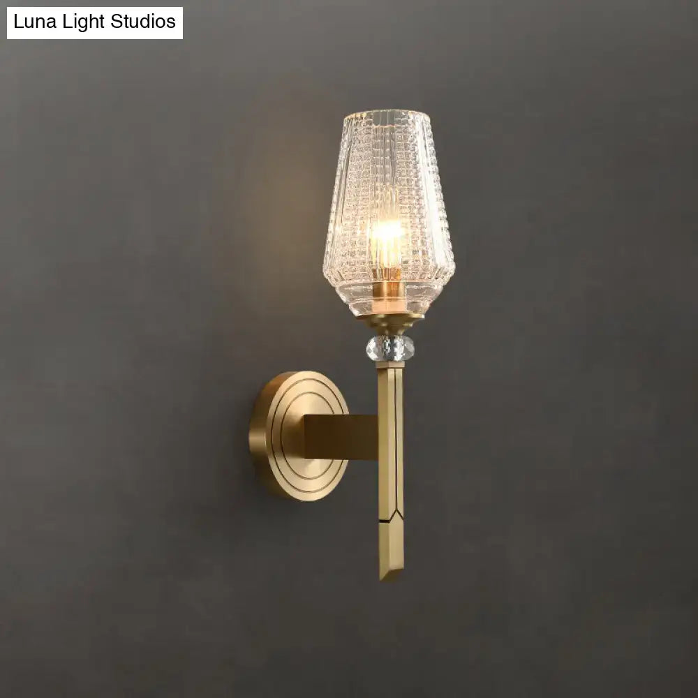 Modern brass diamond wall light with lattice glass shade bedroom