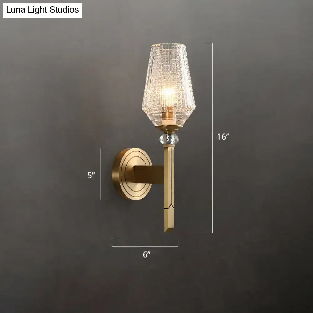 Modern brass diamond wall light with lattice glass shade bedroom