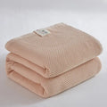 Soft beige cotton honeycomb towel blanket for living room couch